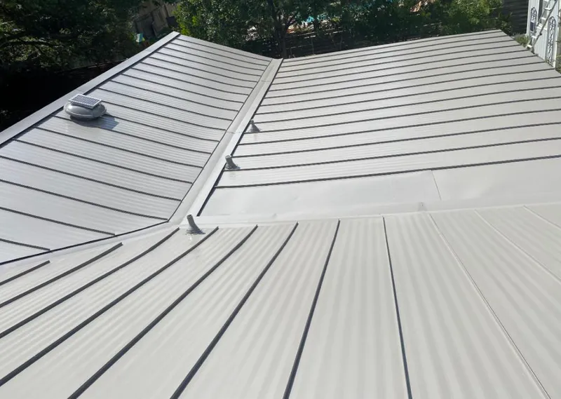 Solar attic fan installed on a metal roof for Roof Ventilation in McAllen